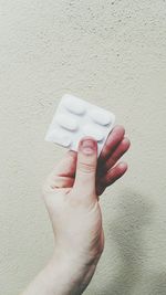 Close-up of human hand holding pills