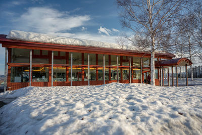 House covered with snow against sky