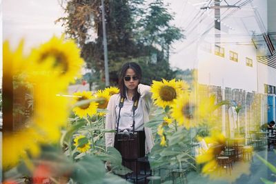 Woman standing on mobile phone