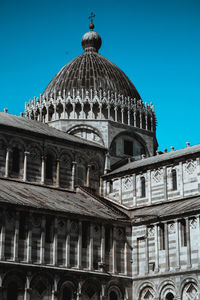 Low angle view of building against blue sky