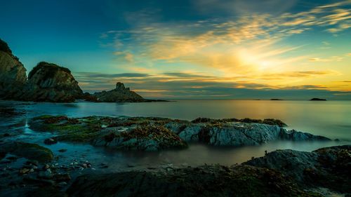 Scenic view of sea against sky during sunset