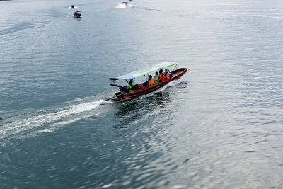 High angle view of people on boat in sea