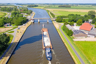 Aerial from towboat and pusher from freight on princes margriet canal in friesland the netherlands