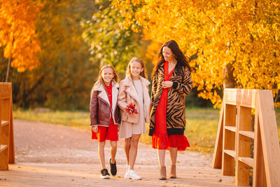 Group of people on road during autumn