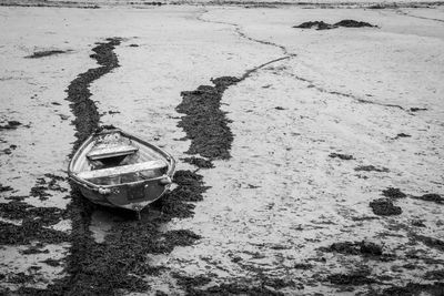High angle view of abandoned boat on sand