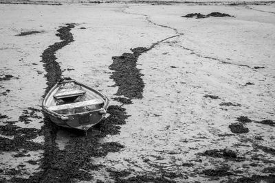 High angle view of abandoned boat on sand