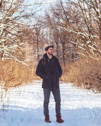 Full length of man standing on snow field
