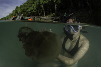 Close-up of woman swimming in water