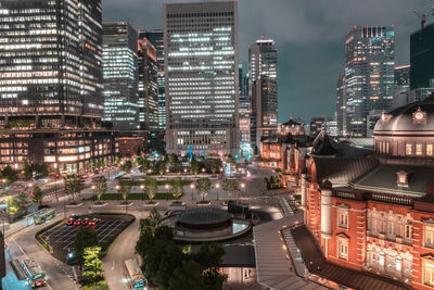 Beautiful urban cityscape with tokyo station under neon night in marunouchi business district, japan