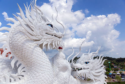 Low angle view of statue against sky