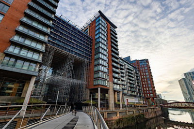 Low angle view of modern buildings against sky