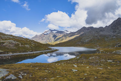 Scenic view of lake and mountains against sky