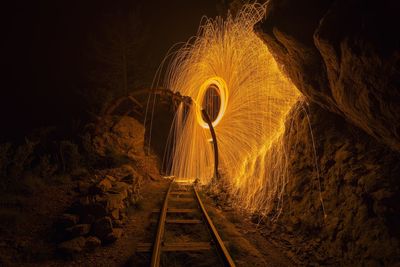Wire wool and abandoned railroad track at night