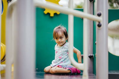 Girl on play equipment