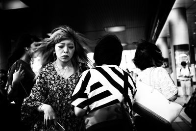 Rear view of people standing in bus