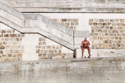 Man standing in front of building