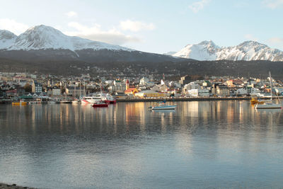 Scenic view of lake and mountains against sky