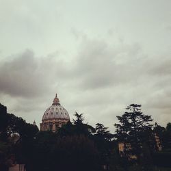 Low angle view of temple against cloudy sky