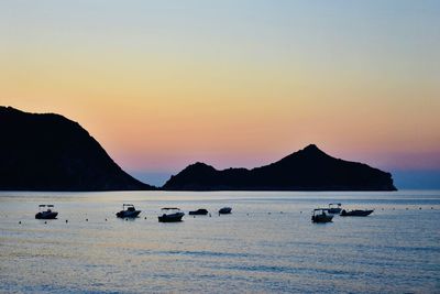 Scenic view of sea against clear sky during sunset