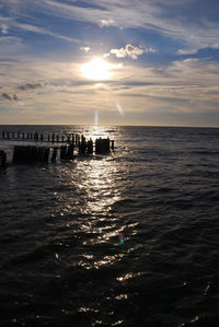 Scenic view of sea against cloudy sky