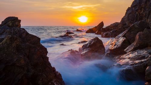 Scenic view of sea against sky during sunset