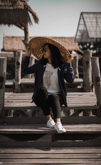 Full length of woman wearing hat