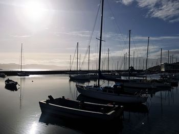 Boats moored at harbor