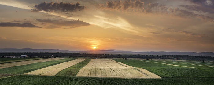Scenic view of landscape at sunset