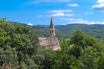 High angle view of trees and buildings against sky