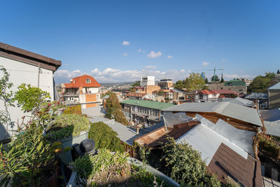 High angle view of townscape against blue sky