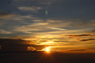 Scenic view of dramatic sky during sunset