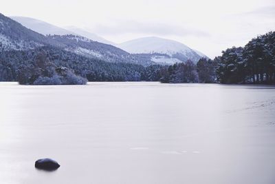 Scenic view of frozen lake against sky