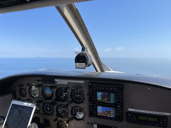 Low angle view of airplane flying against sky