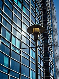 Lamp and post with glass building background