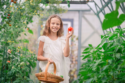 Young woman holding flowers