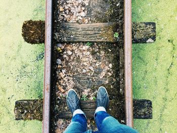 Low section of woman standing on ground