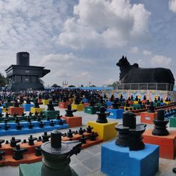 View of buildings in row against cloudy sky
