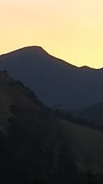 Scenic view of silhouette mountains against sky