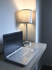 Electric lamp on table at home