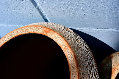 Close-up of rusty metal against wall