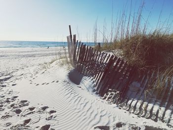 Scenic view of beach against clear sky