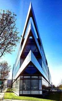 Low angle view of building against blue sky