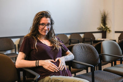 Young woman sitting on chair