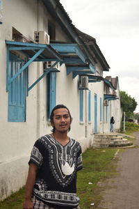 Low section of man standing in building