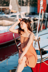 Young woman in a boat against blurred background
