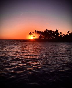 Scenic view of sea against romantic sky at sunset