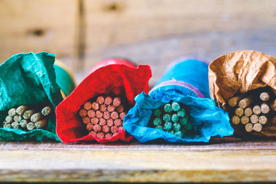 Close-up of colorful incenses on table