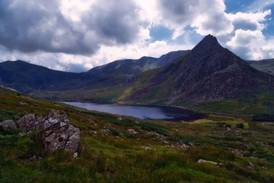 Scenic view of lake and mountains against sky