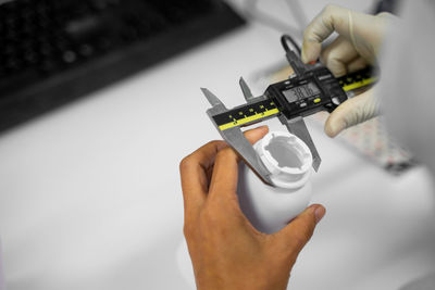 Midsection of person using mobile phone