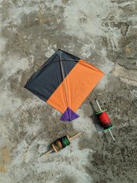 High angle view of multi colored umbrella on wet shore